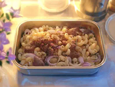 Hühnerherzen mit Hörnchen und Zwiebeln Rezeptbild zu Hühnerherzen mit Hörnchen und Zwiebeln